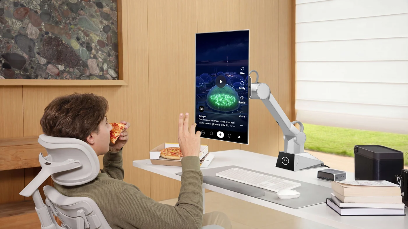 CyboPal ONE in portrait orientation beside a seated desktop user