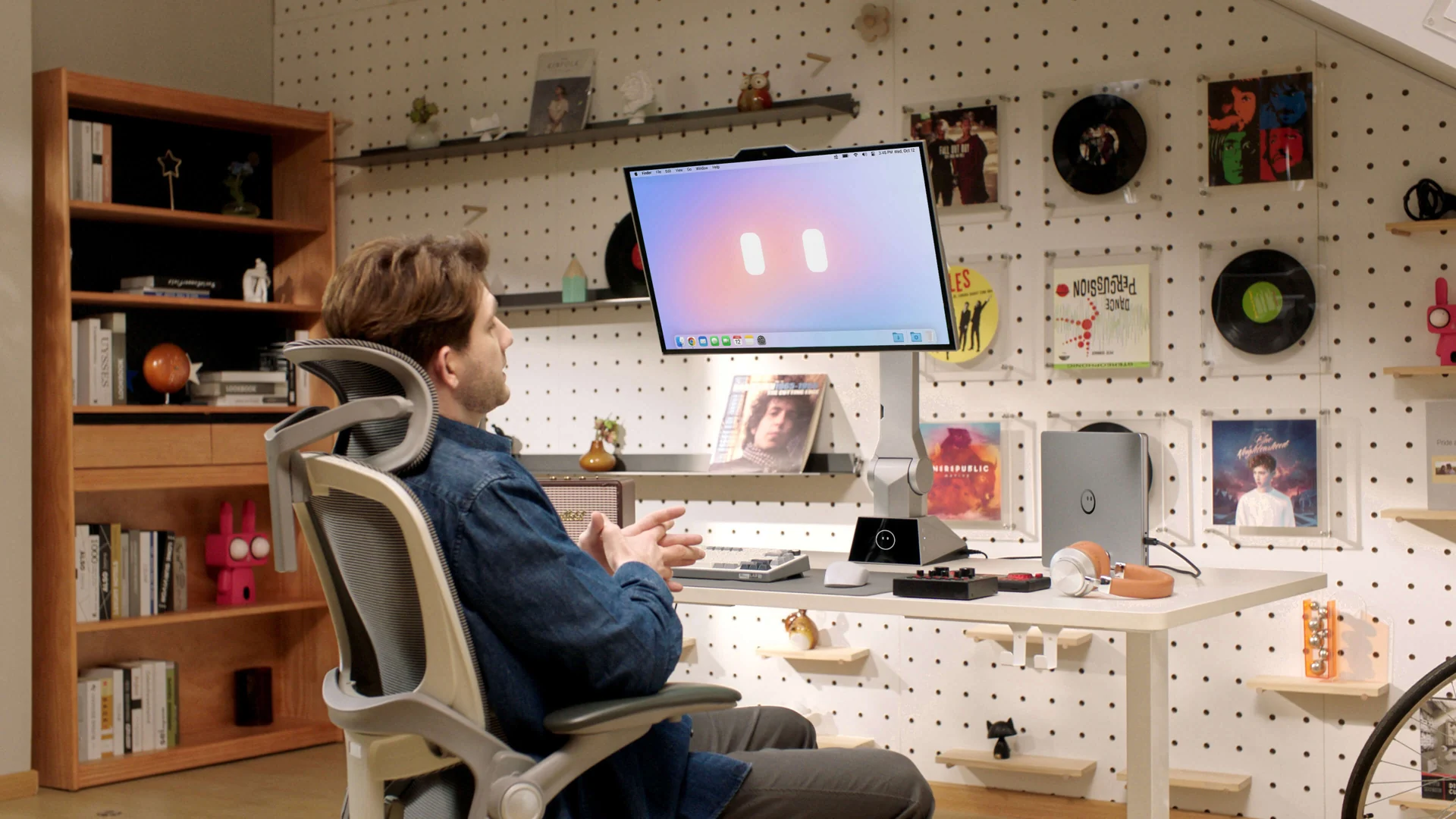 A seated user with CyboPal ONE on a creative workshop desk