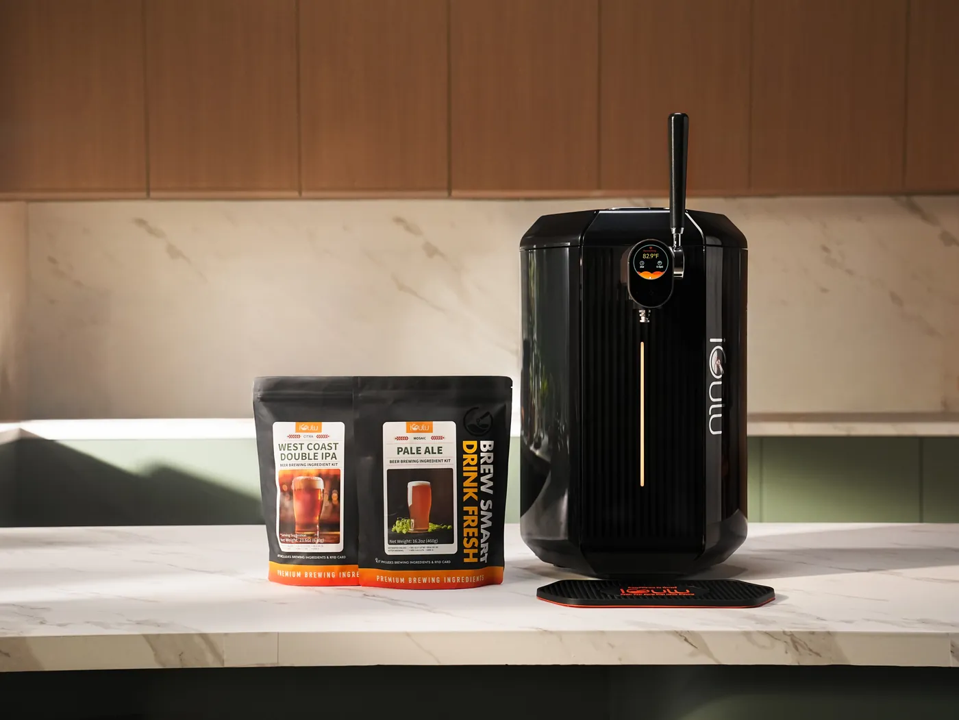 iGulu F2 brewer displayed alongside two ingredient Brew Kits