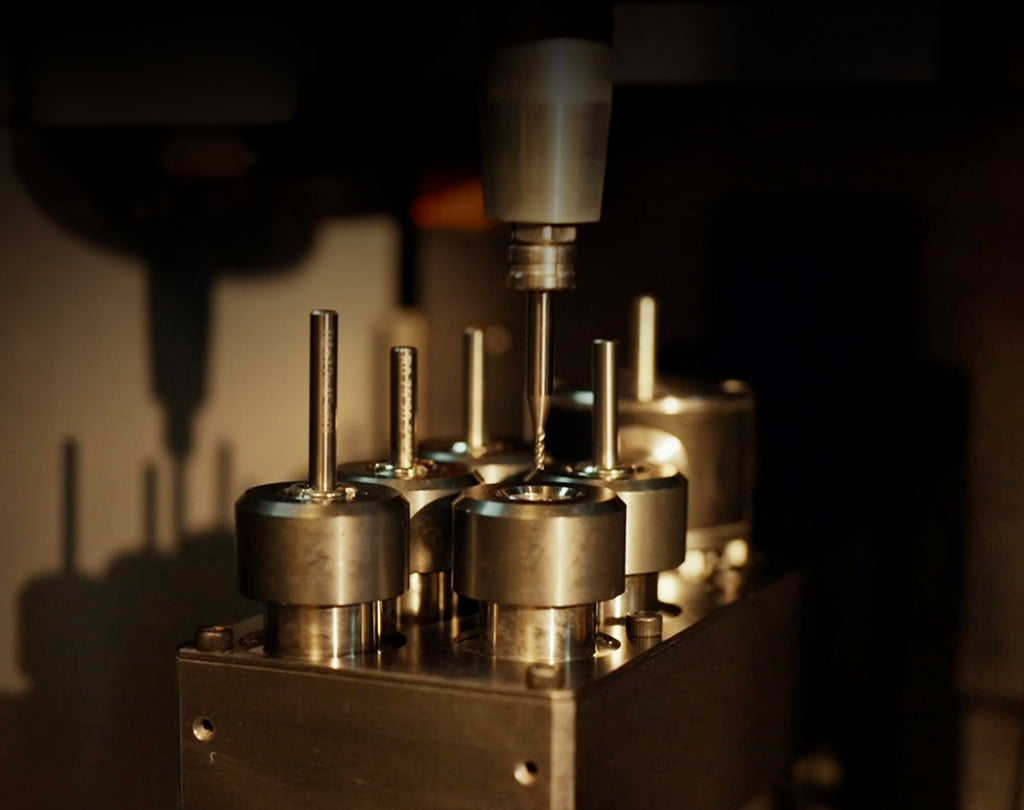 Close view of the InfiMaker K1 automatic tool changer and probe