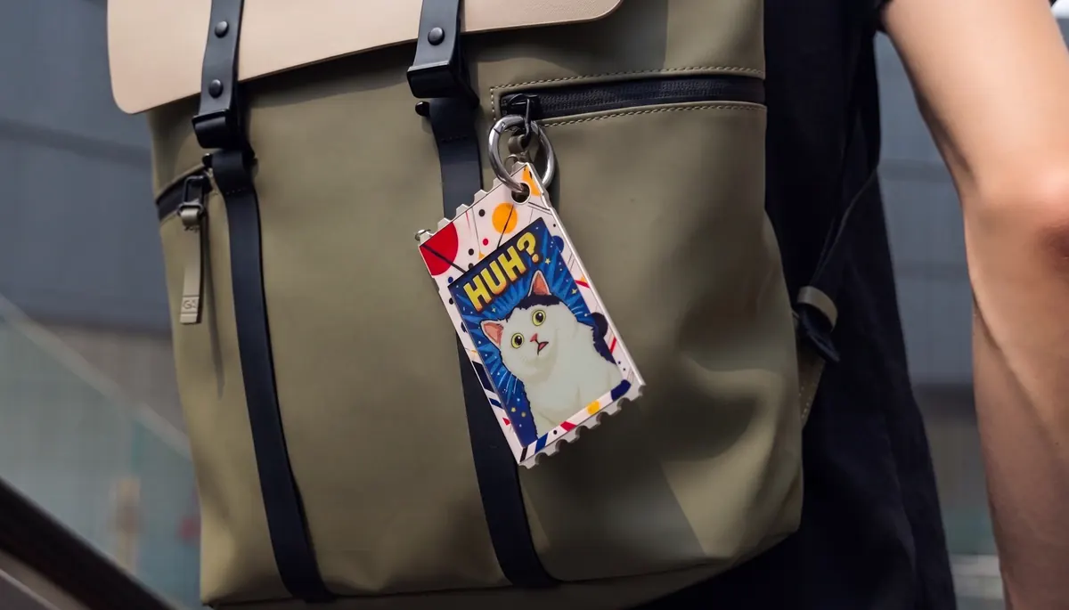 TICKEY displaying a cat design while clipped to a backpack